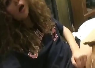 Curly-haired hottie likes hardcore dog sex so much